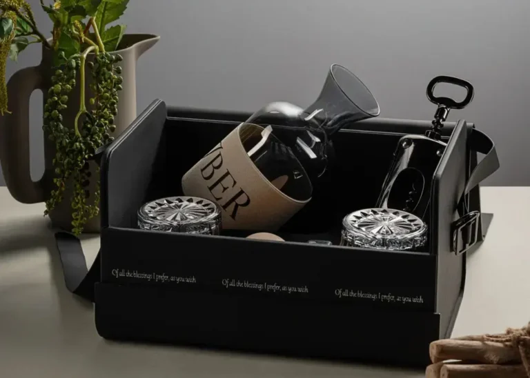 Luxury business gift box with glass decanter, reusable cork stopper, branded whiskey glasses, and cooling stones