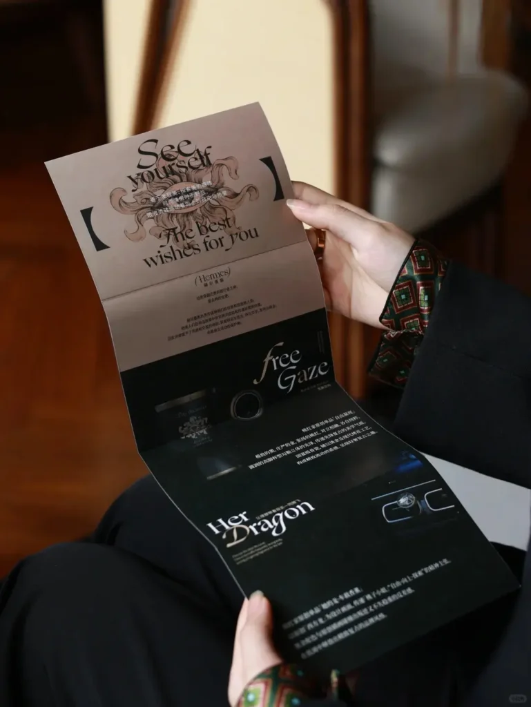 Person opening a blessing envelope from luxury black leather gift box with the title 'The Best Wishes for You'