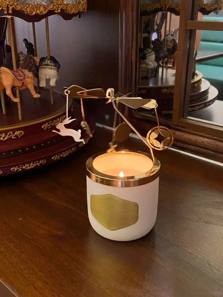Close-up of the rotatable aromatherapy pendant from the purple and blue gradient employee holiday gift box, displayed on a desktop
