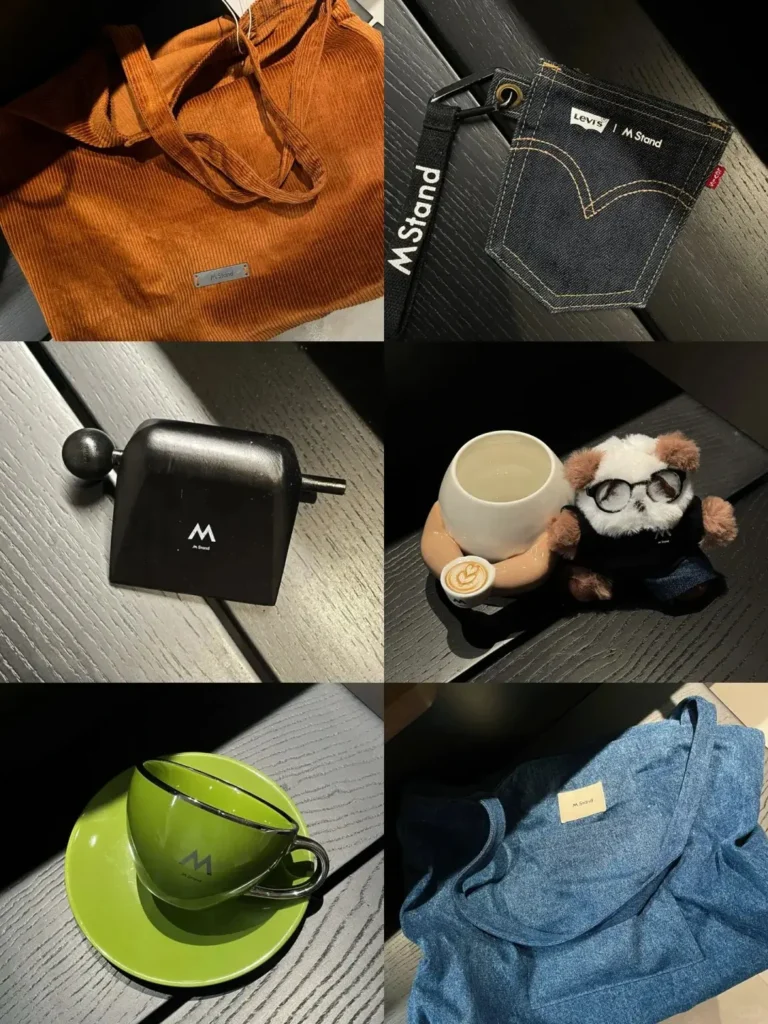 M Stand gift with purchase ideas collection featuring branded crossbody bags, coffee cups, plush toys, coin pouches, and wooden ornaments — creative GWP examples that connect customers with the brand.