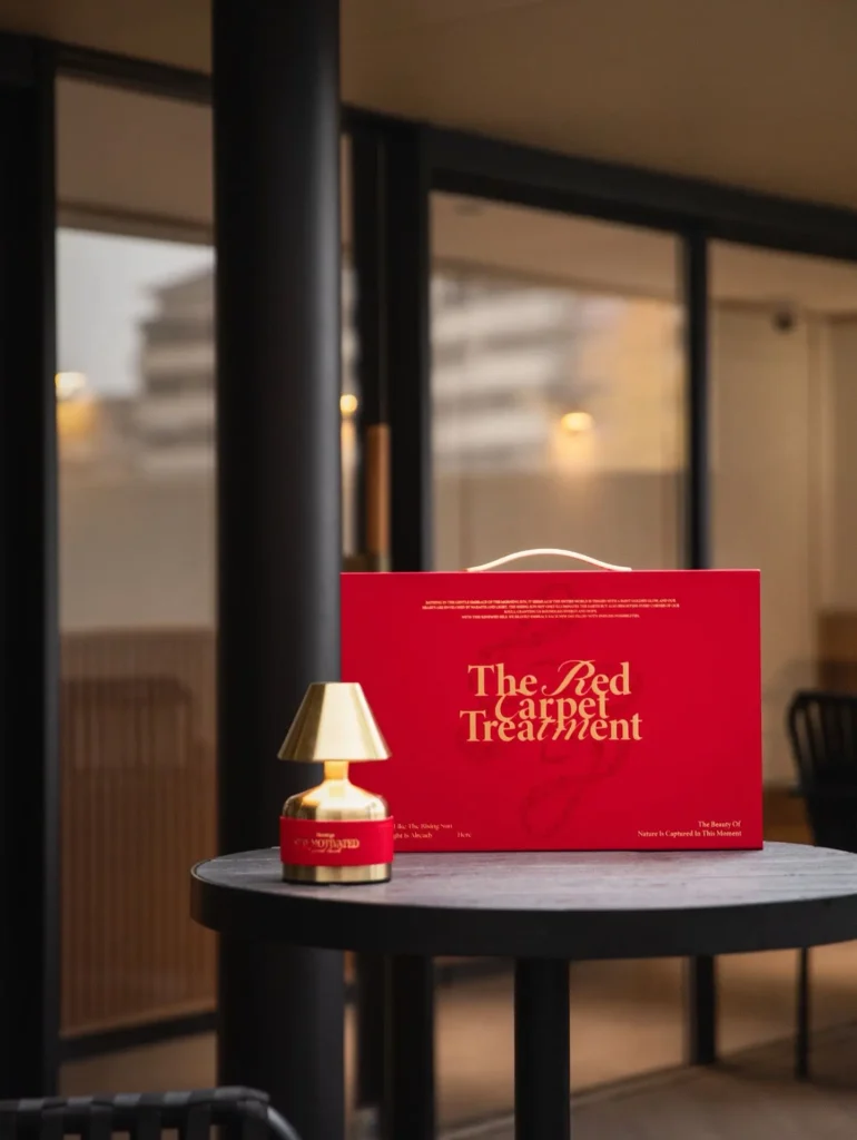 red christmas gift box on table corporate gift idea Corporate & Branded Gifts, Business Gifts & Custom Promotional Products | Executive Gifts, Trade Show Giveaways & LUGVO