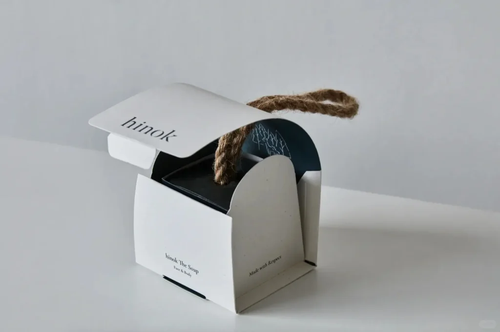 Gift with purchase ideas: how to make “free” feel expensive (and keep customers coming back) 3 White paper gift box tied with jute string, designed as a branded promotional item