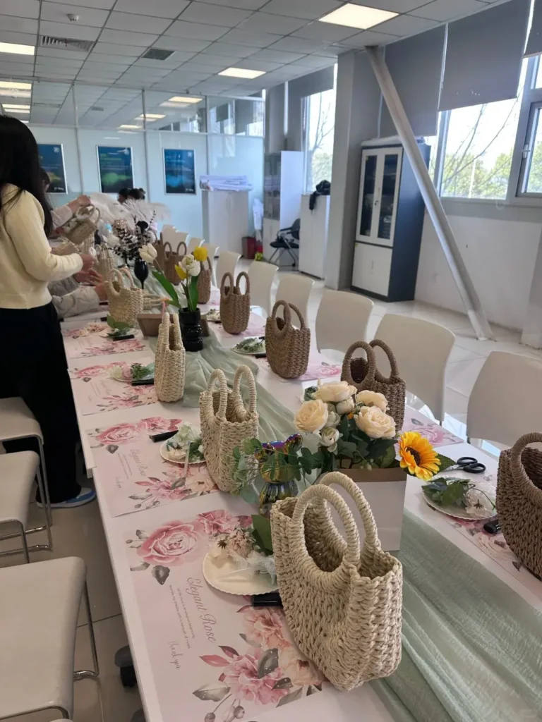 Handwoven employee gift bags lined up on desk ready for packaging, company swag ideas for employees
