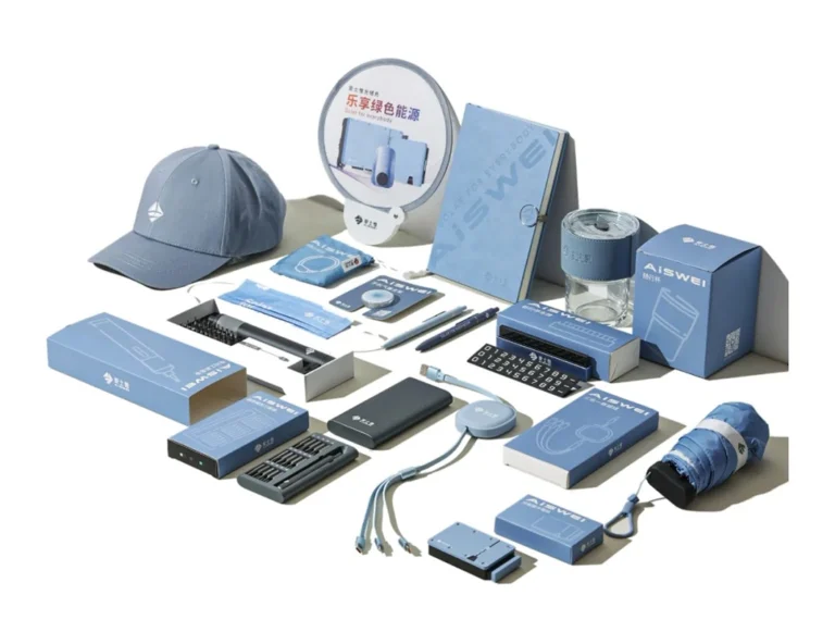 Example of company swag items showing what company swag means, including branded mugs, tote bags, notebooks and t-shirts