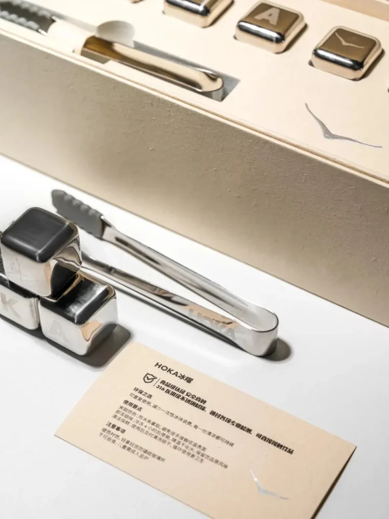 Reusable stainless steel ice cubes with a message card about saving water and sustainability, perfect for eco-friendly corporate gifting by LUGVO.