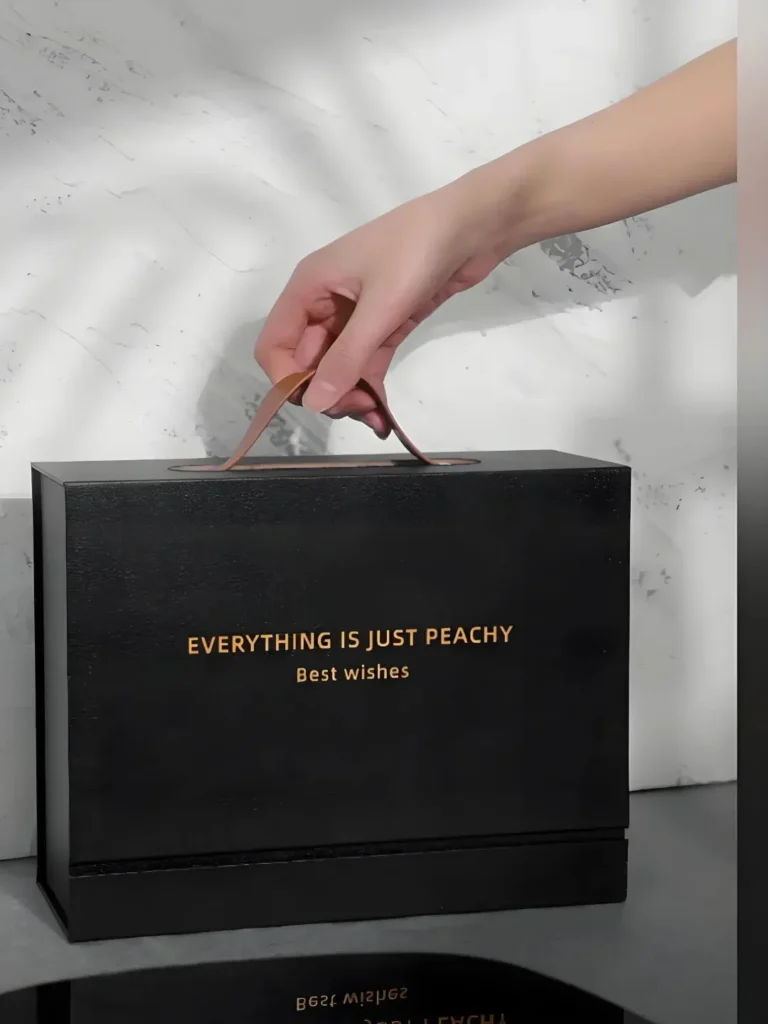 Bespoke Corporate Gifts That Make Business Feel More Personal 1 A black corporate gift box displayed on a desk, featuring personalized text as requested by the client, perfect for bespoke corporate gifting.