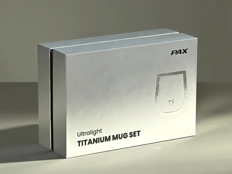 Custom titanium cup gift box featuring a titanium cup, ice cubes, and tongs as premium branded merchandise for client gifting.